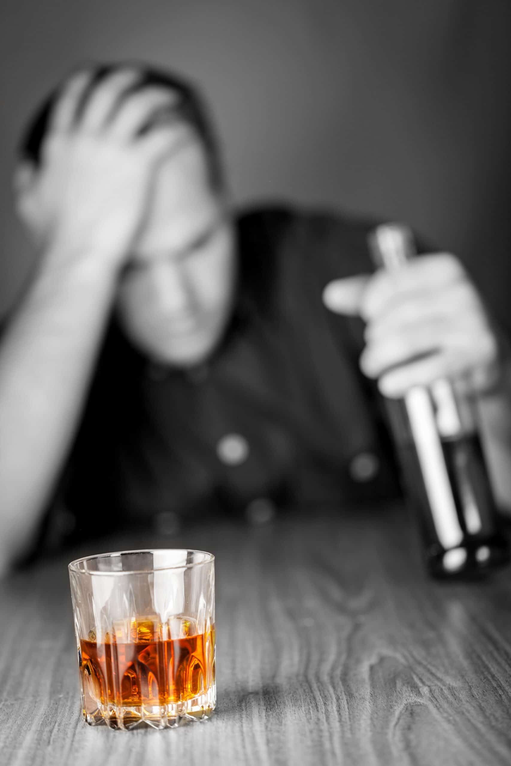 A man struggling with addiction to alcohol.
