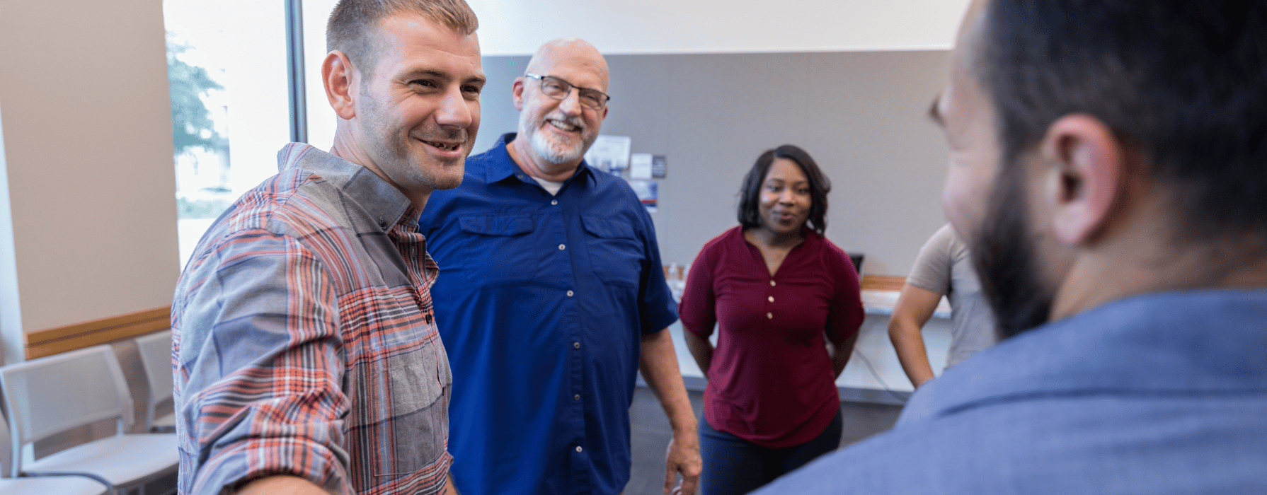 Veterans in group therapy at an addiction rehab facility