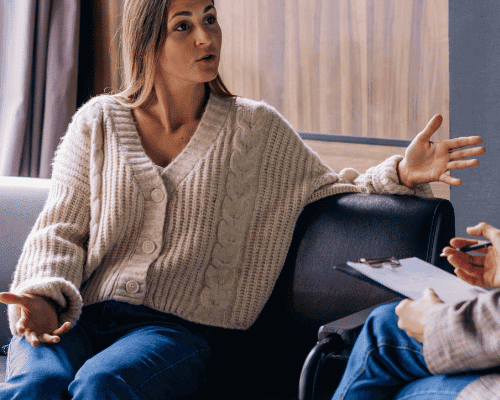 Woman talking to her therapist about types of intensive outpatient programs for addiction