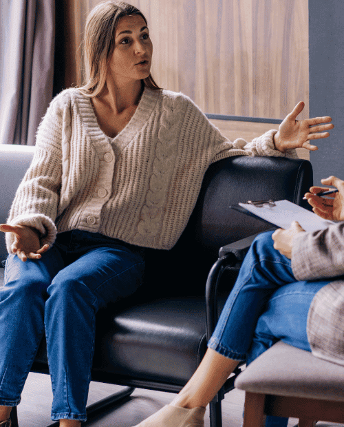 Woman and her therapist discussing PHP addiction treatment options