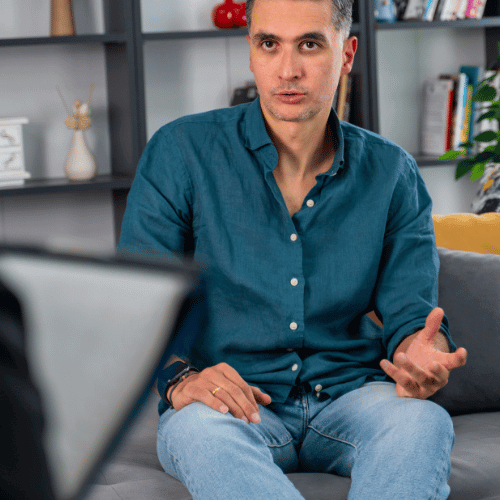 Man discussing addiction therapy treatment programs with a therapist
