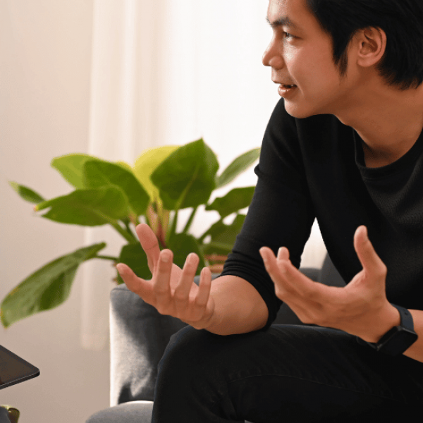A man meeting with his therapist to discuss the value of paying for alcohol rehab