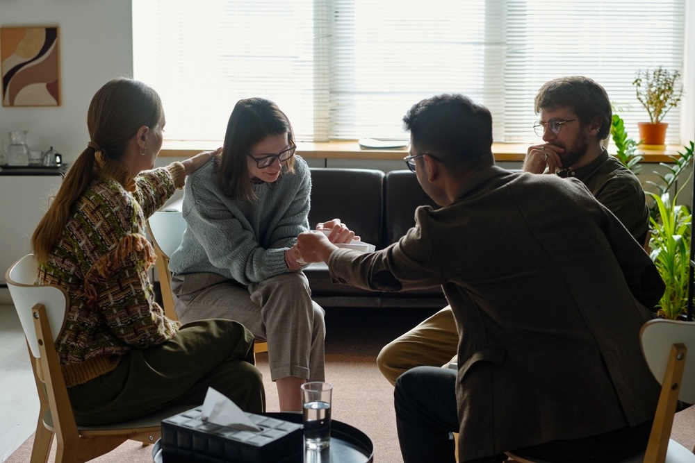 Group staging an addiction intervention