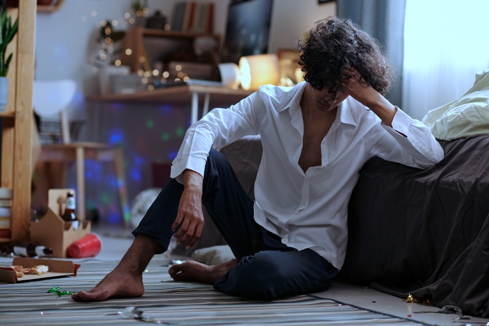 Man feeling the psychological effects of alcohol addiction