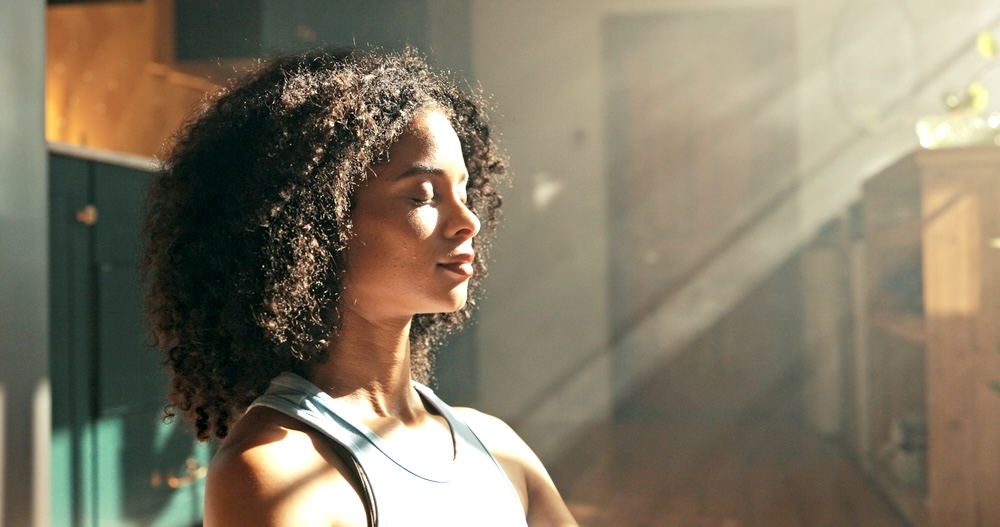 Calm woman meditating while in rehab Los Angeles CA