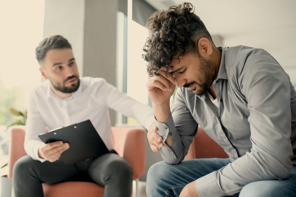 Male in individual therapy inside inpatient rehab